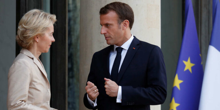 French President Emmanuel Macron talks with European Commission president-elect Ursula Von der Leyen as she leaves at the Elysee Palace in Paris